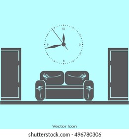 Empty waiting room sofa in front of the door and a clock on the wall