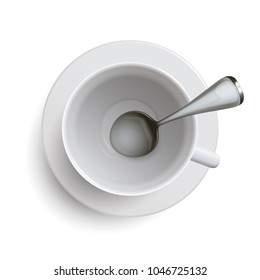 empty white cup with a spoon on a white background