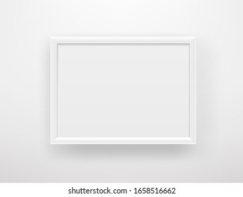 Empty white frame on a white wall. Copy space vector template