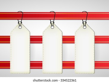 empty white price tags on red ribbon with gold line