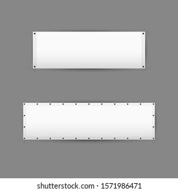 Empty white vinyl banners with grommets. Horizontal blank advertising banners isolated on grey background.