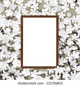 Empty wooden frame on a bed of flowers