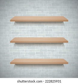 Empty wooden shelf for exhibit on brick wall texture background.