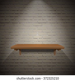 Empty wooden shelf for exhibit on brick wall texture background.