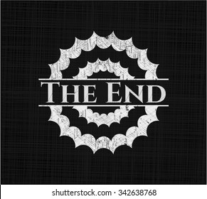 The End chalkboard emblem written on a blackboard