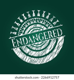 Endangered chalk emblem written on a blackboard. Vector Illustration. Detailed. 