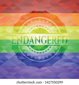 Endangered on mosaic background with the colors of the LGBT flag