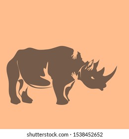 Endangered Species - Rhinoceros in a Salmon Background - animal hugged by a person