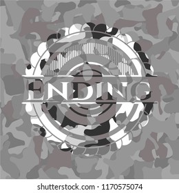 Ending written on a grey camouflage texture