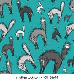 Endless seamless pattern with hand-drawn cats aggressive. The cat ruffled fur, arched his back