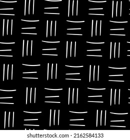 Endless texture of  white dashes, hand drawn on a black square background. Used for printing on paper, fabric, packaging, wallpaper. Eps10.