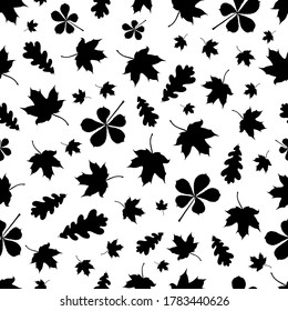 Endless vector pattern with black silhouettes of leaves: maple, oak and chestnut leaves. Leaf fall.