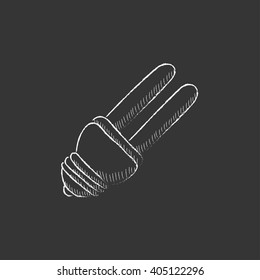 Energy saving light bulb. Drawn in chalk icon.