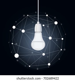 An energy saving light bulb hanging on a wire and a ball of dots and lines around it on a blue background