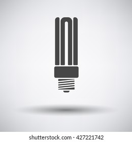 Energy saving light bulb icon on gray background with round shadow. Vector illustration.