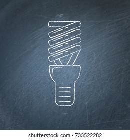 Energy saving light bulb icon sketch on chalkboard. Spiral lamp linear symbol - chalk drawing on blackboard.