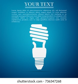 Energy saving light bulb icon isolated on blue background. Flat design. Vector Illustration