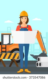 Engineer holding a blueprint.