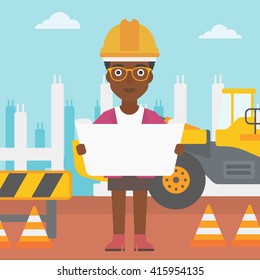 Engineer holding a blueprint.