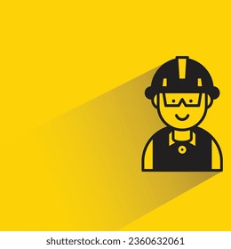 engineer with shadow on yellow background
