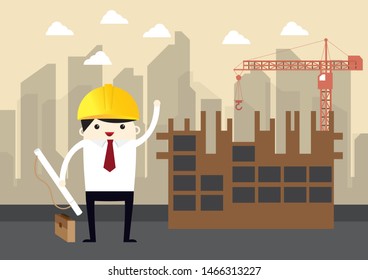 engineer stand with yellow helmet with construction site on background