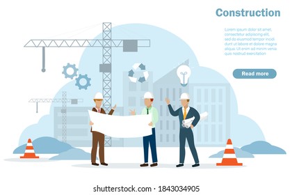 Engineers at construction site holding blueprints discussing project plan with buildings and heavy industrial cranes background. 