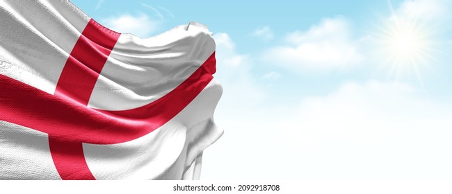 England flag in the blue sky. Horizontal panoramic banner.