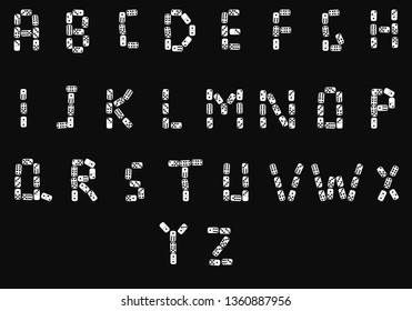 English alphabet made from domino bones.Isolated on black