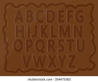English alphabets for kids written on chocolate bar.
