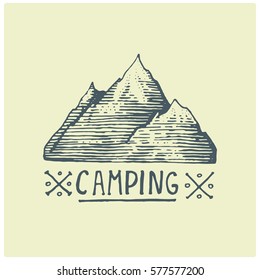 engraved vintage logo with mountains in hand drawn, sketch style, old looking retro badge for national parks and camping, alpine and hiking theme.