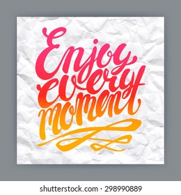 Enjoy every moment -  hand-drawn quote on crumpled paper background 