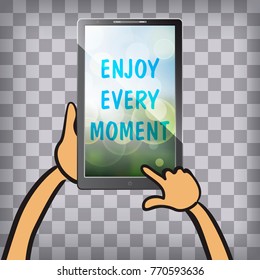 Enjoy every moment on the screen of multimedia tablet on chequered background. Typography on beautiful colorful background with bokeh.