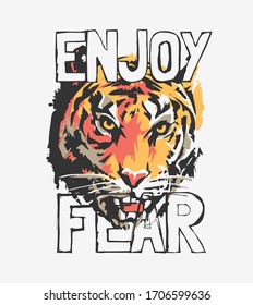 enjoy fear slogan with tiger face graphic illustration