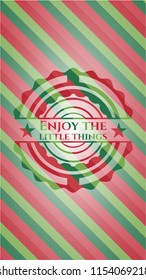 Enjoy the little things christmas emblem background.