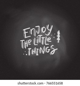 Enjoy the little things Hand drawn lettering on the blackboard background. Stock vector