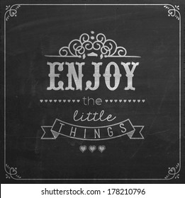 Enjoy The Little Things Quote Typographical Background On Blackboard With Chalk