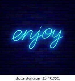 Enjoy neon lettering signboard. Shiny calligraphy. Motivation emblem. Glowing effect banner. Text on brick wall. Luminous label. Editable stroke. Vector stock illustration