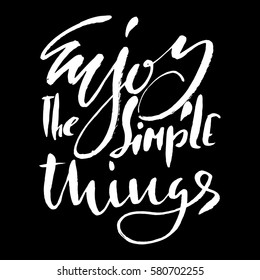 Enjoy the simple things. Hand drawn lettering. Vector typography design isolated on white background. Handwritten inscription
