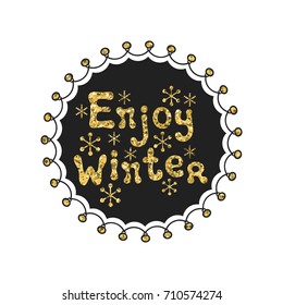 Enjoy winter calligraphy gold phrase. Handwritten glitter seasons lettering. Xmas phrase. Hand drawn element. Holidays. Greeting card text. Christmas calligraphy. Label badge sticker. Christmas