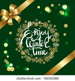 Enjoy winter time inscription in frame made of golden and silver snowflakes vector on green with glittering sparkles, decorated by ribbon and bow in corners