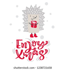 Enjoy xmas calligraphy lettering text. Christmas scandinavian greeting card with hand drawn vector illustration of hedgehog with gift. Isolated objects.