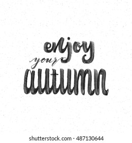 Enjoy your autumn . Trace written by pen brush . Positive phrase can be used as print, stamp, banner or label , for  corporate identity