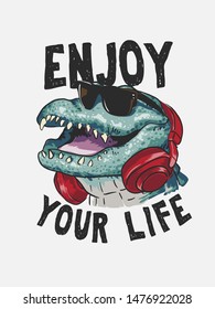 enjoy your life slogan with cartoon alligator in sunglasses and headphone illustration 