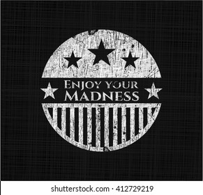 Enjoy your Madness chalk emblem written on a blackboard