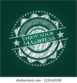 Enjoy your Madness chalkboard emblem written on a blackboard