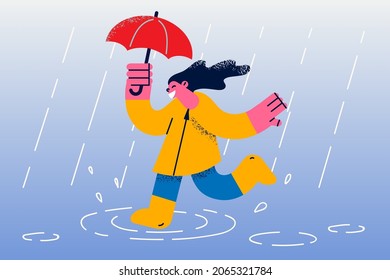 Enjoying fall and autumn weather concept. Smiling excited girl cartoon character walking outdoors in rubber boots and umbrella enjoying rain vector illustration 