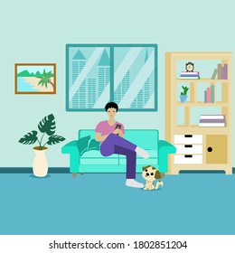 Enjoying free time. man using phone while sitting on the sofa at home with the cute dog,man relaxing at home with dog