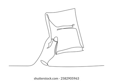 Enjoying a moment of reading with an open book in hand during a relaxing time