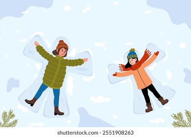 Enjoying winter fun while making snow angels in a snowy landscape