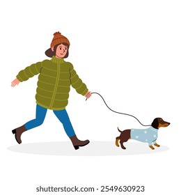 Enjoying a winter walk with a dachshund in a cozy sweater and puffer jacket